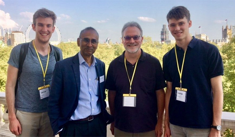 NQPI member David Drabold (center right) poses in Cambridge, England with Nobel laureate Venkatraman “Venki” Ramakrishnan (center left) and his sons, Will (left) and Edward (right). Drabold spent last spring at Trinity College during his sabbatical. (Photo courtesy of David Drabold)
