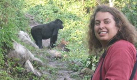 Jessica Rothman in woods with gorilla in the backround.