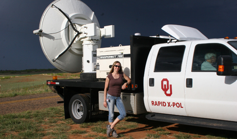 Dr. Jana Houser with University of Oklahoma’s Rapid-scan, X-band, polarimetric mobile radar (RaXPol) truck.