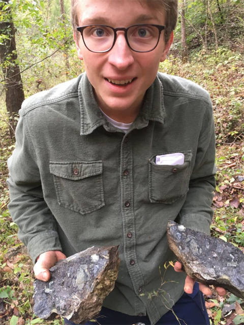 HTC Geological Sciences student Thomas Johns holds samples of kimberlite collected in Elliott County, Ky., which contain pieces of the Earth's mantle.