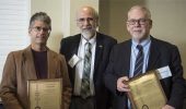 Executive Vice President and Provost Chaden Djalali (middle) awards Douglas Goetz (left) and Stephen Bergmeier (right) with U.S. patent plaques. Photo credit: Hannah Ruhoff.