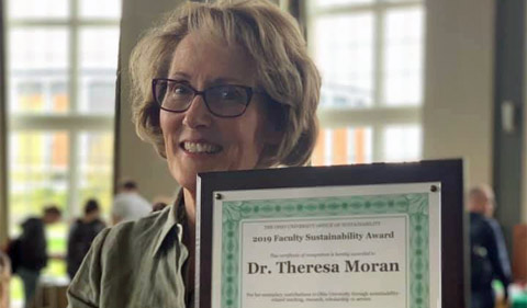 Dr. Theresa Moran poses with her 2019 Faculty Sustainability Award.