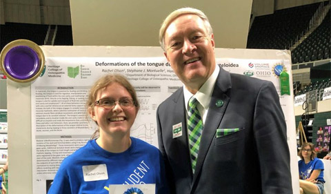 Rachel Olson with President M. Duane Nellis at the Student Research & Creativity Expo