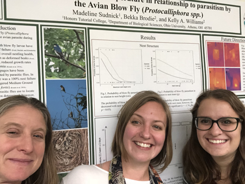 Dr. Kelly Williams, Dr. Bekka Brodie and Madeline Sudnick pose with her research poster.