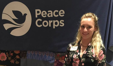Ryan Kauchak with Peace Corps logo