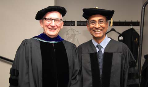 The 2019 Distinguished Professor Steve Evans (left) poses for a photo with 2019 honorary degree recipient and Nobel Prize winner Venkatraman "Venki" Ramakrishnan (right). 