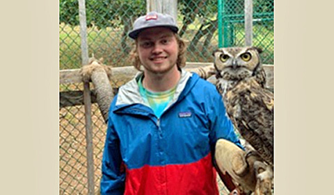 Naturalist Adam Hunt with Earl, the Great Horned Owl