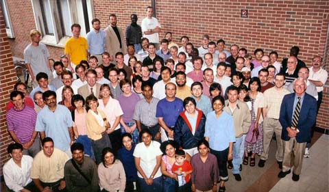 Andreas Weichselbaum (back row, yellow shirt) in a group photo of physics students.