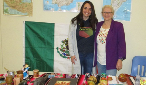 Spanish graduate student Carli Henman and Dr. Betsy Partyka pose at the Bunsold Middle School Hispanic Cultural Celebration.