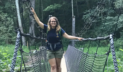 Maddie Sudnick on a rope bridge