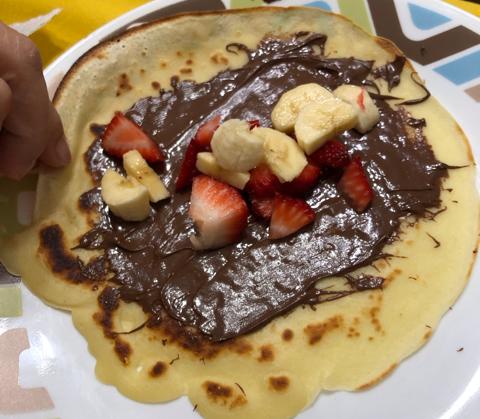 Crepes with bananas, strawberries and Nutella