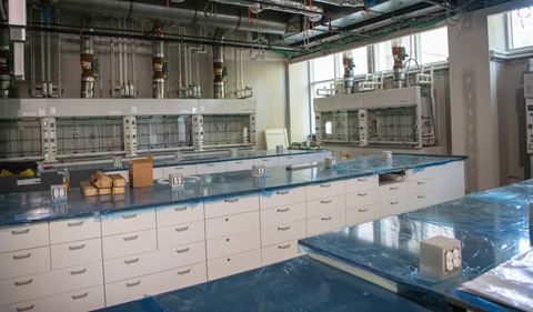 A lab in the new chemistry building with bright work spaces and ventilation.