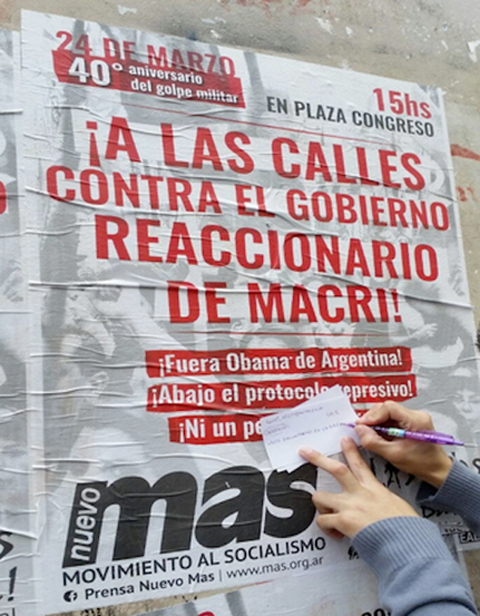 A poster visible on the Ciencias Sociales campus of the University of Buenos Aires during the 40th Anniversary Commemoration of the Period of State Terror refers to the commemoration and calls on Porteños (residents of Buenos Aires) to take to the streets to protest the “reactionary” policies of the Macri government in power in 2016, when this photo was taken. It also demands that U.S. President Obama leave Argentina. The former president had planned to attend the 40th anniversary events. 