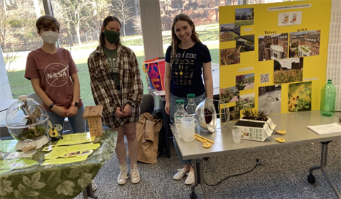 Victoria Swiler, Sam McAvoy, Caroline Whitt (and other students not pictured here) organized a table for the Family Science Day, March 19, 2022 to teach children about green roofs, photosynthesis and insects. Photo by Sarah Maracz.