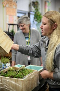 Rachel Modzelewski shared an early prototype for the green roof model with Athens Middle School Teacher, Mary Ann Hopple. The Mechanical Engineering class sought feedback from teachers during development. Photo by Ellee Achten