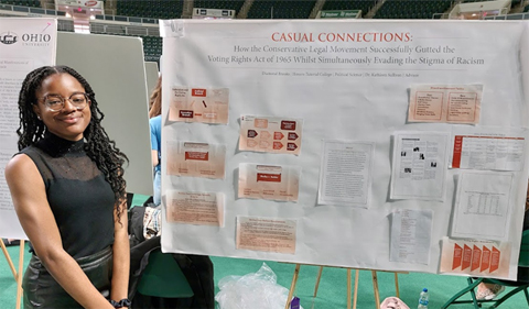 Diamond Brooks presents her poster on "Casual Connections" at the Student Research and Creativity Expo