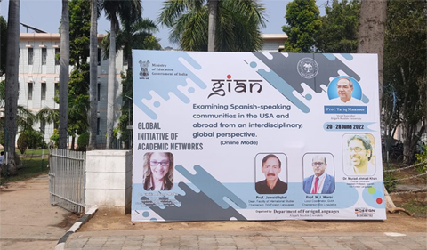 A poster advertises the seminar on the campus of Aligarh Muslim University. 