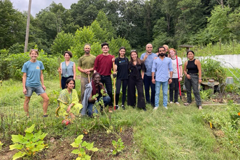 Fulbright scholars work with the Community Food Initiatives at the community garden.